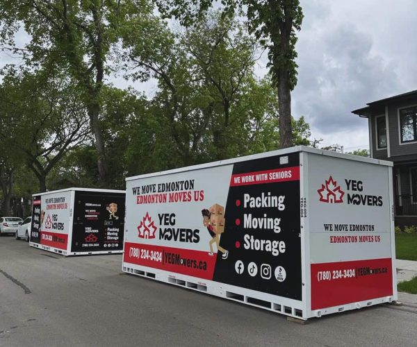 YEG Movers moving storage containers on street.